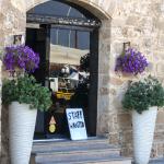 'Staff wanted' sign in front of a cafe