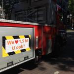 Social distancing promoted on an Amsterdam fire department ladder truck