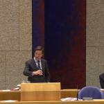 Prime Minister Mark Rutte, with Health Ministers Tamara van Ark and Hugo de Jonge behind him, during a parliamentary debate on the Covid-19 vaccination policy, 5 January 2021