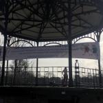 Two people working out in the Amsterdam Oosterpark under a banner calling for all schools in the Netherlands to reopen, 19 February 2021