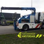 Dutch police towing away a car after an illegal street race in Amsterdam.