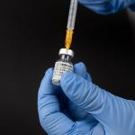 Preparing a syringe with the Comirnaty Covid-19 vaccine from Pfizer/BioNTech. June 2021
