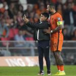 A young fan ran onto the pitch to take a selfie with Memphis Depay of the Netherlands during the World Cup 2022 group G qualifying football match between the Netherlands and Montenegro at the Philips stadium in Eindhoven, 4 September 2021