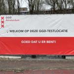 A banner at the entrance of the GGD coronavirus testing and vaccination facility in Amsterdam-Noord. 9 April 2022