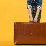 Child holding a suitcase