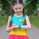 Girl uses GPS watch.