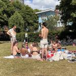 A group of people enjoying the sun on Java-Eiland in Amsterdam. 16 July 2022