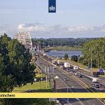 A view to the south on the A27 near Gorinchem as caravans, trucks, and many cars with trailers or rooftop boxes drive by on 16 July 2022