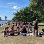 People enjoying a barbecue on Java-eiland in Amsterdam, 16 July 2022