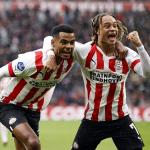 EINDHOVEN - (l-r) Cody Gakpo of PSV Eindhoven, Xavi Simons of PSV Eindhoven celebrate the 2-1 during the Netherlands eredivisie match between PSV Eindhoven and Feyenoord Rotterdam in the Phillips stadium on 18 september 2022 in Eindhoven, Netherlands.