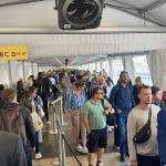 Travelers wait under a canopy at Schiphol on Sept. 17, 2022.