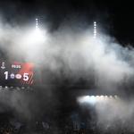 FC Zurich's supporters wave flags under the score board half hidden by smoke during the UEFA Europa League football 1st round day 3 group A match between FC Zurich and PSV Eindhoven at Letzigrund stadium in Zurich on October 6, 2022. 