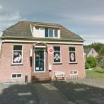 Google street view of house with swastikas.