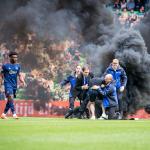 Supporters storm the field during the Dutch premier league match between FC Groningen and Ajax at the Euroborg stadium on May 14, 2023 in Groningen.