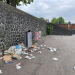 Litter left on the street next to a trash can near the NEMO Science Museum in Amsterdam. 18 June 2023