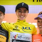 Team SD Worx's Belgian rider Lotte Kopecky (L), Team SD Worx's Dutch rider Demi Vollering wearing the overall leader's yellow jersey (C) and Canyon SRAM Racing's Polish rider Katarzyna Niewiadoma celebrate on the general ranking podium at the end of the eighth and final stage of the Tour de France Femmes, 30 July 2023