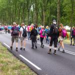 People walking into Arnhem, about 12 kilometers north of Nijmegen, at the start of the Vierdaagse on 16 July 2019