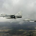 Two Dutch F-16 fighter jets in the air