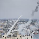 Rockets are launched by Palestinian militants from the Gaza Strip towards Israel, in Gaza, Saturday, Oct. 7, 2023.