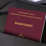 Rendering of a Dutch passport in a shoulder bag