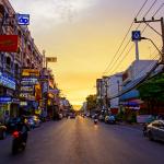 A street in downtown Nakhon Ratchasima, Thailand, at dusk