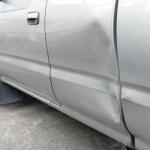 Car with a dent in the door
