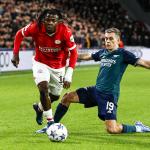 Johan Bakayoko of PSV Eindhoven, Leandro Trossard of Arsenal FC during the UEFA Champions League match in group B between PSV Eindhoven en Arsenal FC in het Phillips stadium on 12 december 2023 in Eindhoven, Netherlands.