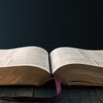 Christian bible on a wooden table