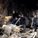 Family members of a man missing since an explosion and fire in an apartment building on Schammenkamp in Rotterdam call for police officers after finding a body in the rubble, 31 January 2024