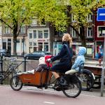 Mother with three children on the bicycle in Amsterdam