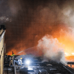 Firefighters fighting a massive fire caused by an explosion in an apartment building on Scammenkamp, 29 January 2024