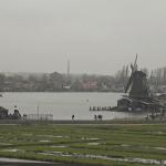 Tourists visit the windmills of the Zaanse Schans in Zaandam on a dreary morning. 2 January 2024