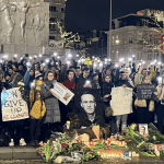 People at a memorial for Russian opposition leader Alexei Navalny at the National Monument on Dam Square in Amsterdam.