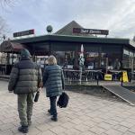 People walking by De Carrousel pancake restaurant in Amsterdam Centrum. 7 February 2024
