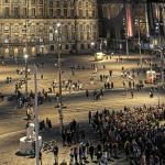 People begin to arrive at a memorial for Russian opposition leader Alexei Navalny at the National Monument on Dam Square in Amsterdam hours after his death at the age of 47. 16 February 2024