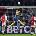 Ajax goalkeeper Diant Ramaj, Ezri Konsa of Aston Villa FC during the UEFA Conference League round of 16 match between Ajax Amsterdam and Aston Villa FC at the Johan Cruijff ArenA on March 7, 2024 in Amsterdam, Netherlands