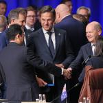 Dutch Prime Minister Mark Rutte with Japanese PM Fumio Kishida and German Chancellor Olaf Scholz at a NATO summit in Lithuania, 12 July 2023
