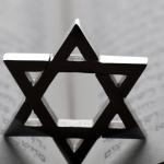 Jewish star or star of David on a Torah. 
