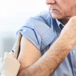 Elderly man getting a vaccination