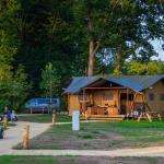 Dalfsen, Neterlands - June 19, 2020: Family enjoying their bungalow tent in the middel of nature at recreation park in the Netherland
