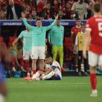 The Austria bench reacts as Kylian Mbappe of France pulls up pausingg play after breaking his nose during the UEFA European Championships match at Dusseldorf Arena, Dusseldorf. 17 June 2024