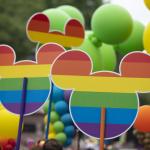 Disney Micky Mouse signs with pride flags at the annual Pride in London, 2019. 