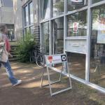 A woman enters a polling station in Amsterdam to vote in the European Parliament election on 6 June 2024.