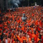 Oranje fans march through the streets of Hamburg toward the Netherlands' first match in the 2024 European Championship against Poland, 16 June 2024