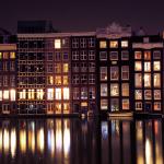 The rear of buildings along the Warmoesstraat in Amsterdam, as seen from Damrak. 13 February 2019