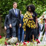 Mark Rutte and Linda Nooitmeer walk past wreathes during the national memorial ceremony about the Dutch history of slavery. 1 July 2024