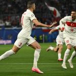 Turkey's defender #03 Merih Demiral (L) celebrates with teammates after scoring his team's first goal during the UEFA Euro 2024 round of 16 football match between Austria and Turkey at the Leipzig Stadium in Leipzig on July 2, 2024. 