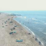 Beachgoers hanging out on the North Sea coast in Petten, Noord-Holland. 18 July 2024