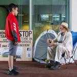 11-year-old Mikael speaks with 79-year-old Eduard Disch, who is on day 25 of a hunger strike at the IND calling for a children's pardon, 5 August 2024