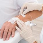 IV drip inserted in a patient's hand